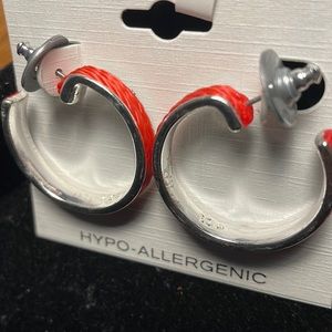 1in diameter silver color wrapped in tangerine thread.